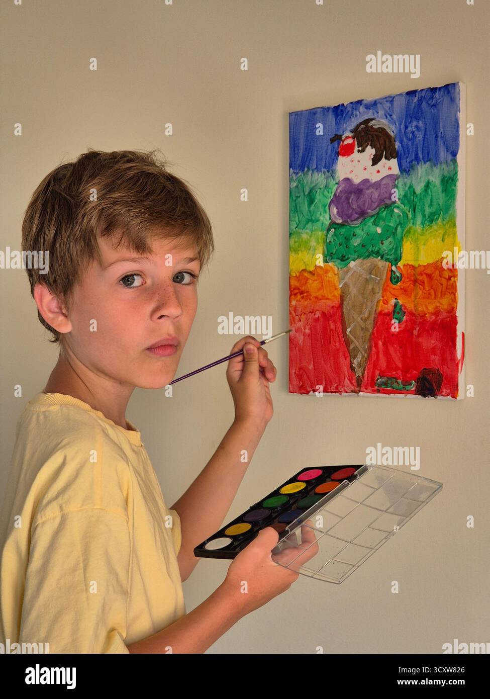 A boy paints a picture. - Smartphone Captured Stock Image