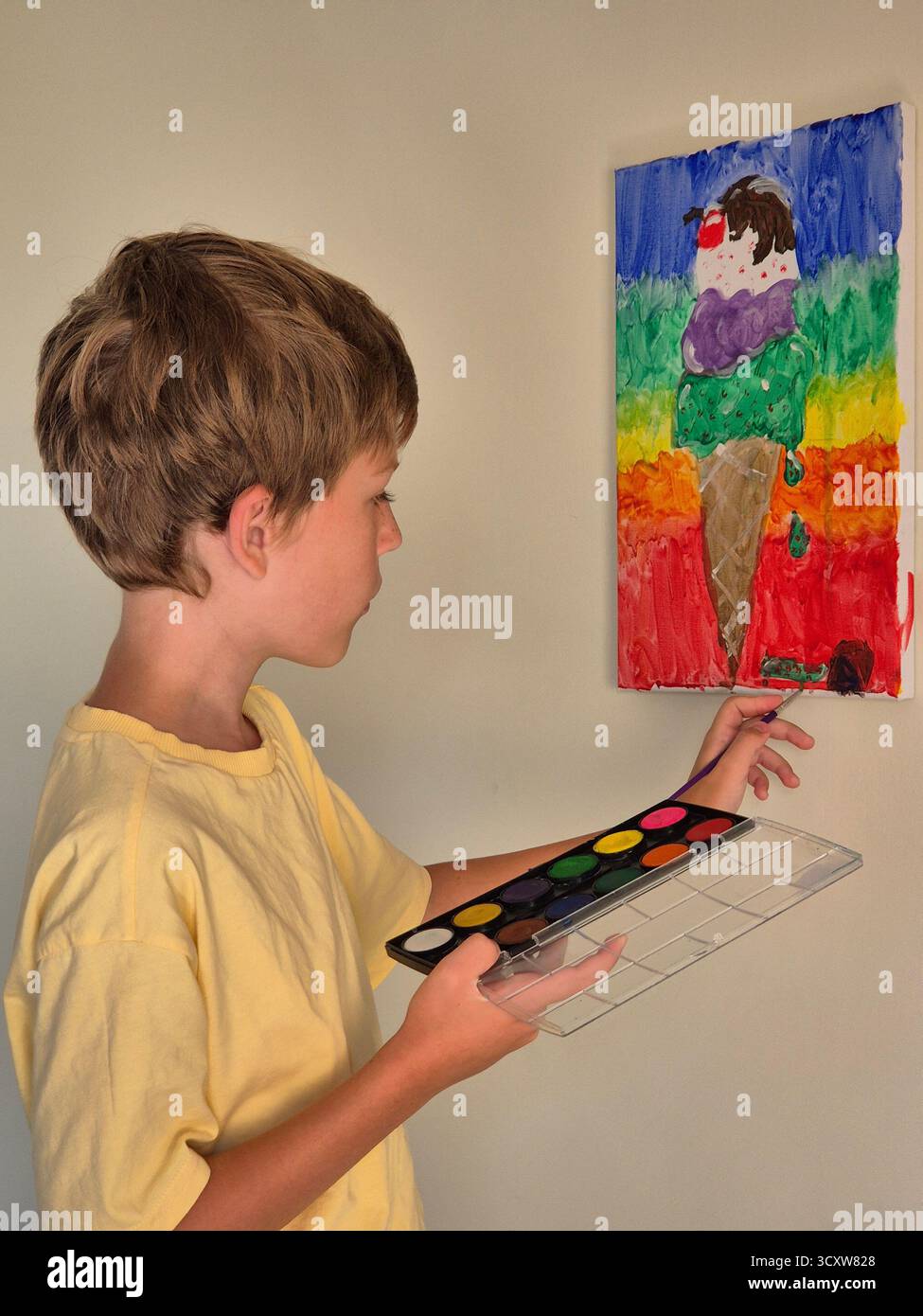 A boy paints a picture. - Smartphone Captured Stock Image