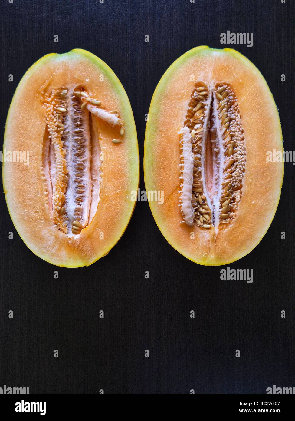 sliced yellow melon. melon seeds - Smartphone Captured Stock Image