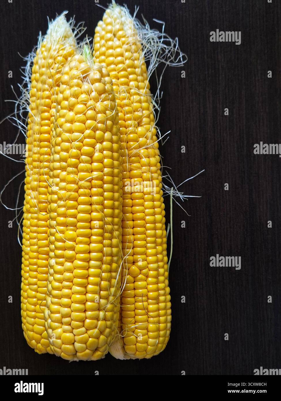 fresh corn on a wooden table - Smartphone Captured Stock Image