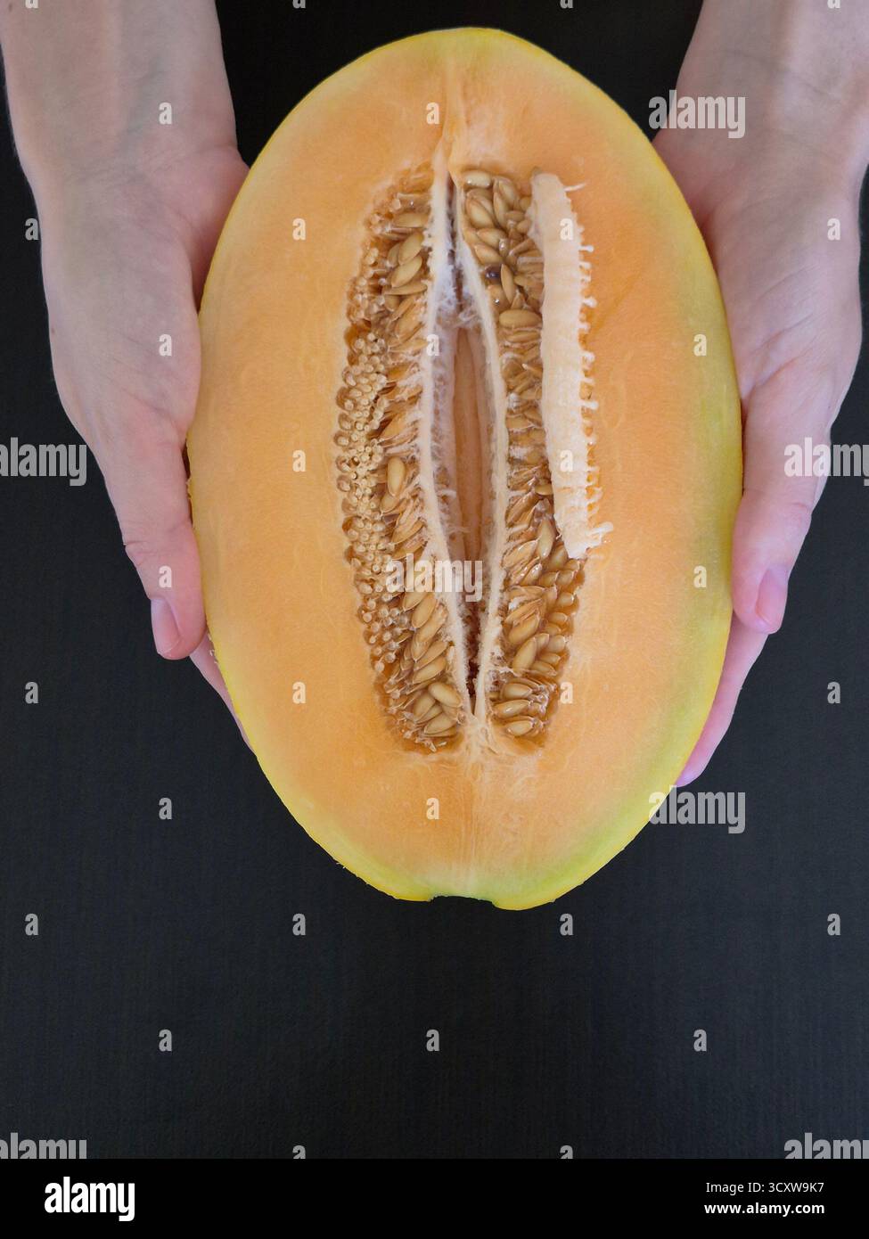 sliced yellow melon. melon seeds - Smartphone Captured Stock Image