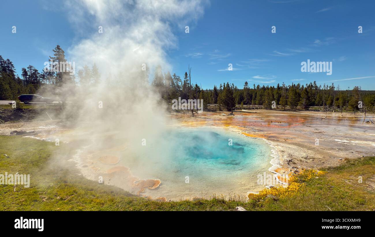 Steam rising from the colourful Celestine Pool hot spring on the Fountain Paintpots Trail in Yellowstone National Park. - Smartphone Captured Stock Image