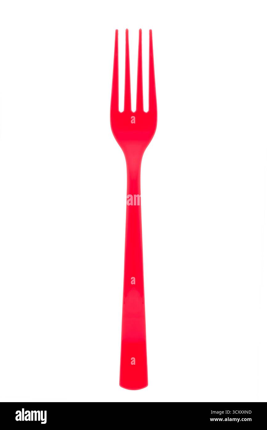 Red plastic fork on white background Stock Photo