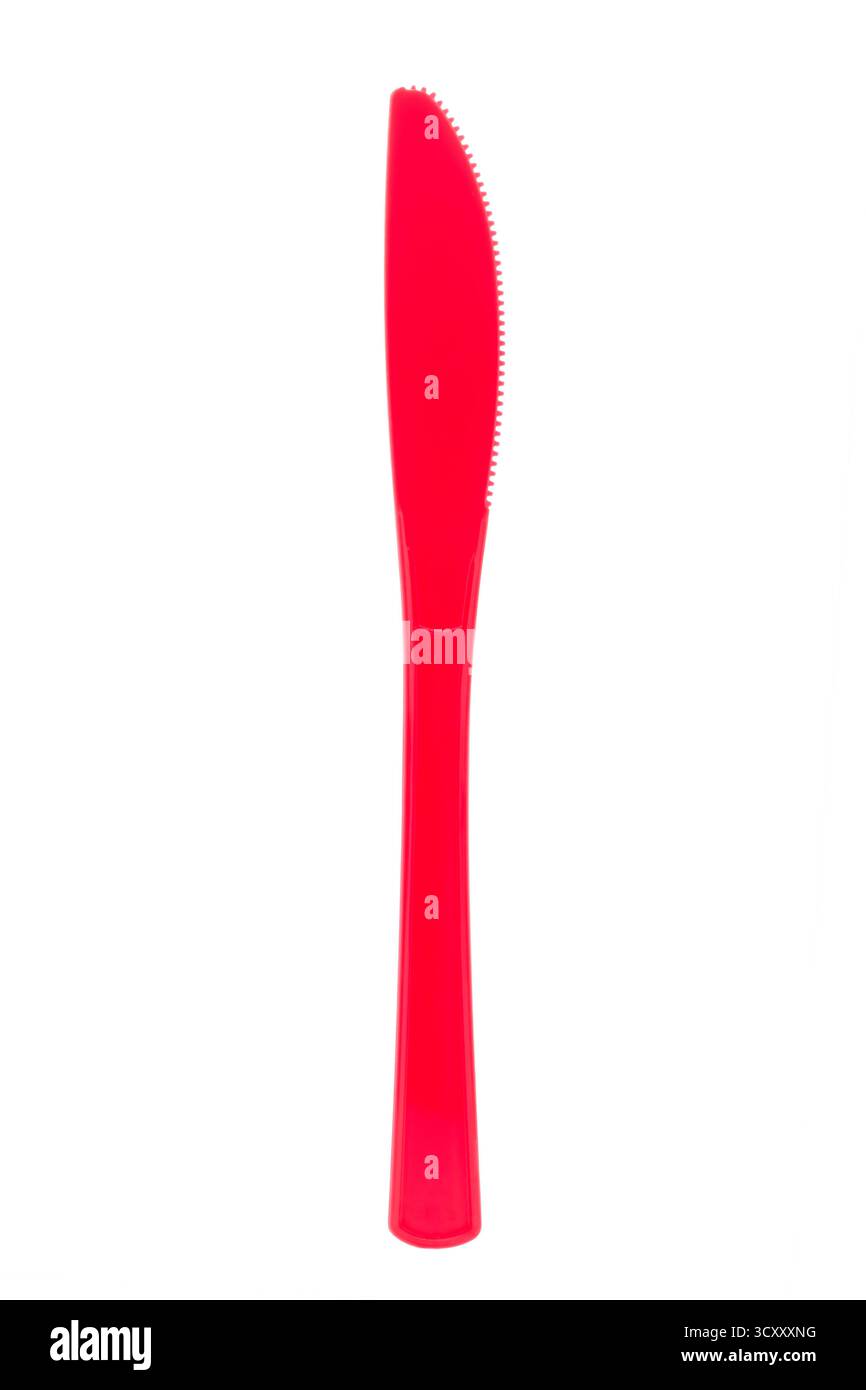 Red plastic knife on white background Stock Photo