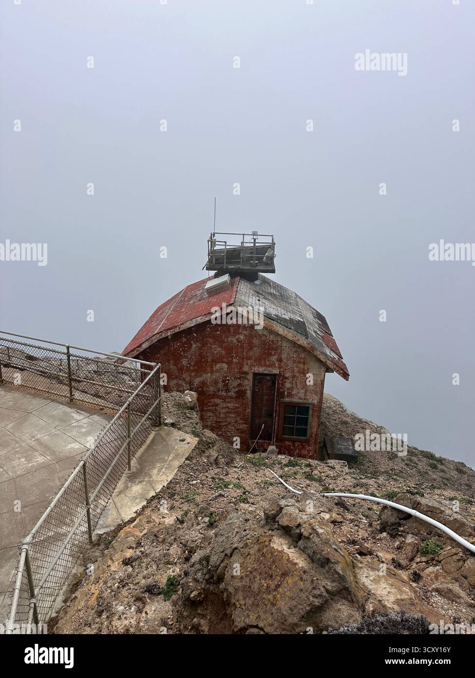 Weathered Lighthouse Building in Fog – Point Reyes, California - Smartphone Captured Stock Image
