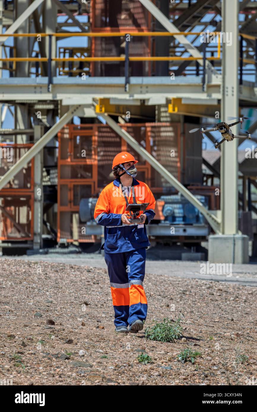 industrial drone pilot mapping and inspecting at a diamond mine metal ...