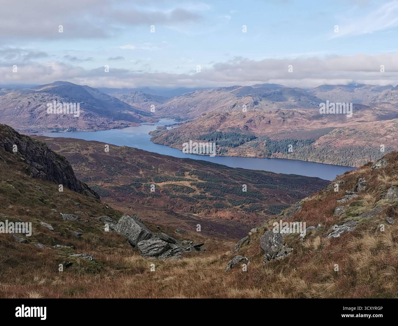 View from Ben Venue over Loch Katrine, Garradh, Maol Mor, Cruinn Bheinn and Glen Finglas in the Trossachs, Scotland in autumn. Highland landscape. - Smartphone Captured Stock Image