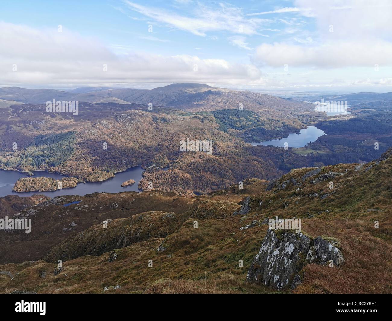 Panoramic view from Ben Venue summit over Loch Venacher, Loch Achray & Loch Katrine in Scotland’s Trossachs National Park – scenic Highlands landscape - Smartphone Captured Stock Image