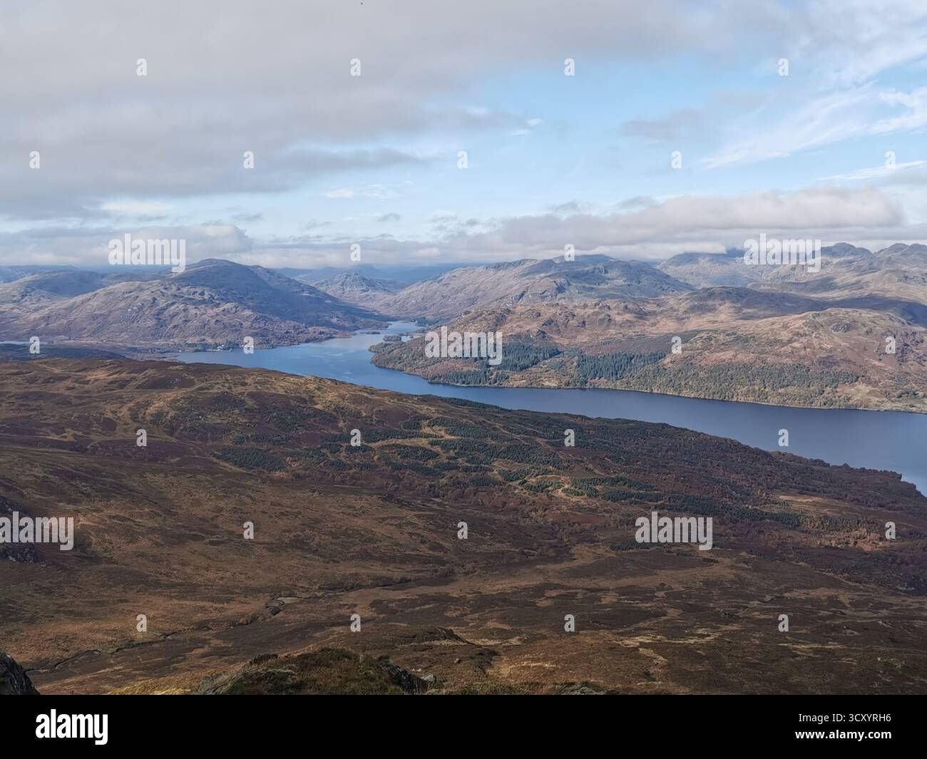 View from Ben Venue over Loch Katrine, Garradh, Maol Mor, Cruinn Bheinn and Glen Finglas in the Trossachs, Scotland in autumn. Highland landscape. - Smartphone Captured Stock Image