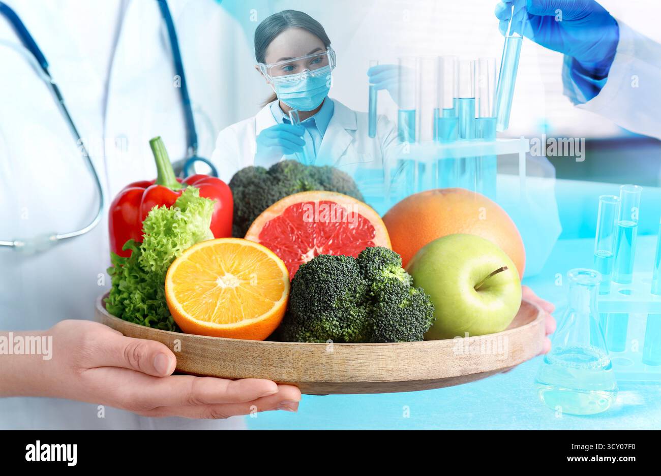 Laboratory food analysis. Expert holding fresh fruits and vegetables ...