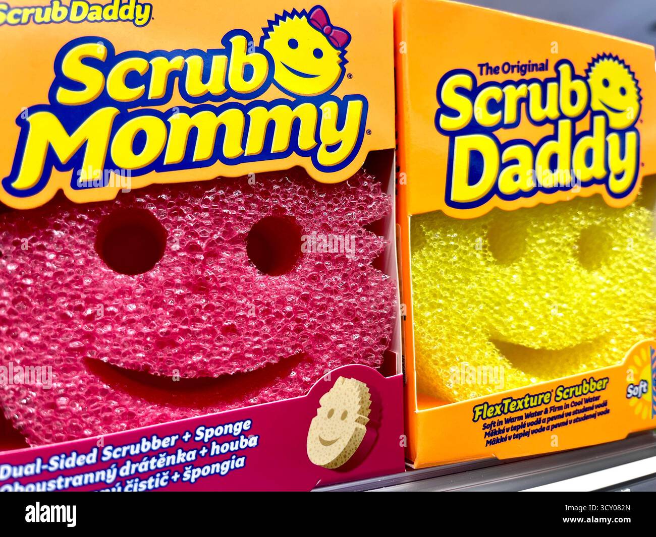 Scrub Daddy and Scrub Mommy kitchen scrubbers cleaning sponges on store shelf - Smartphone Captured Stock Image