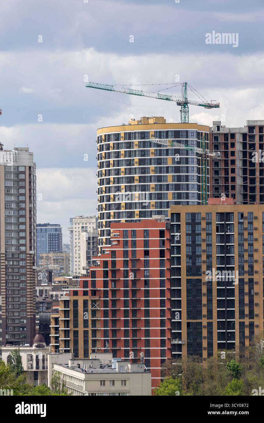 Urban High Rise Construction with Tower Crane and Modern Apartments