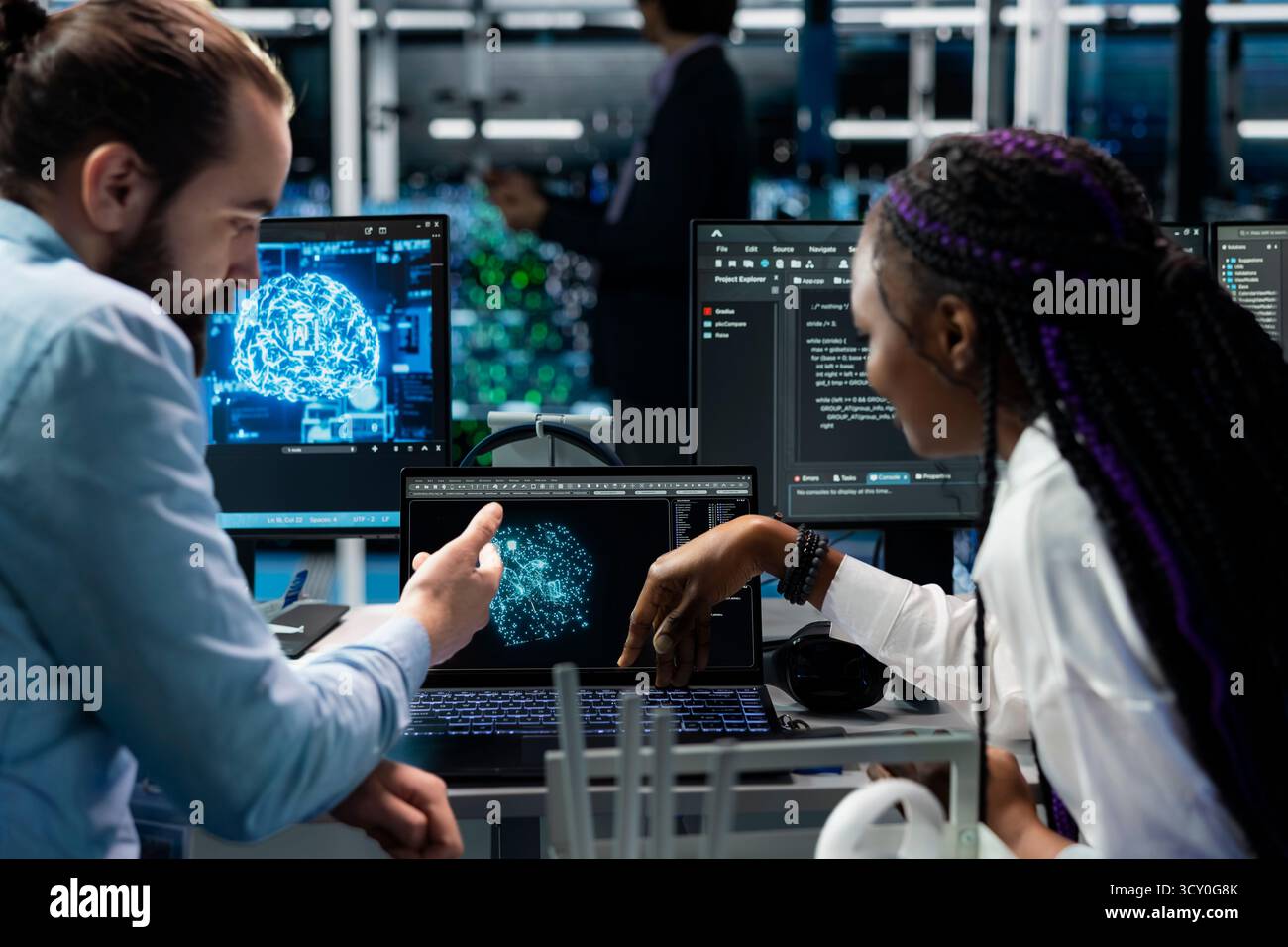 Computer scientists in data center installing upgraded server racks systems helped by AI technology. Server room IT experts upgrading enterprise networks hardware using artificial intelligence Stock Photo