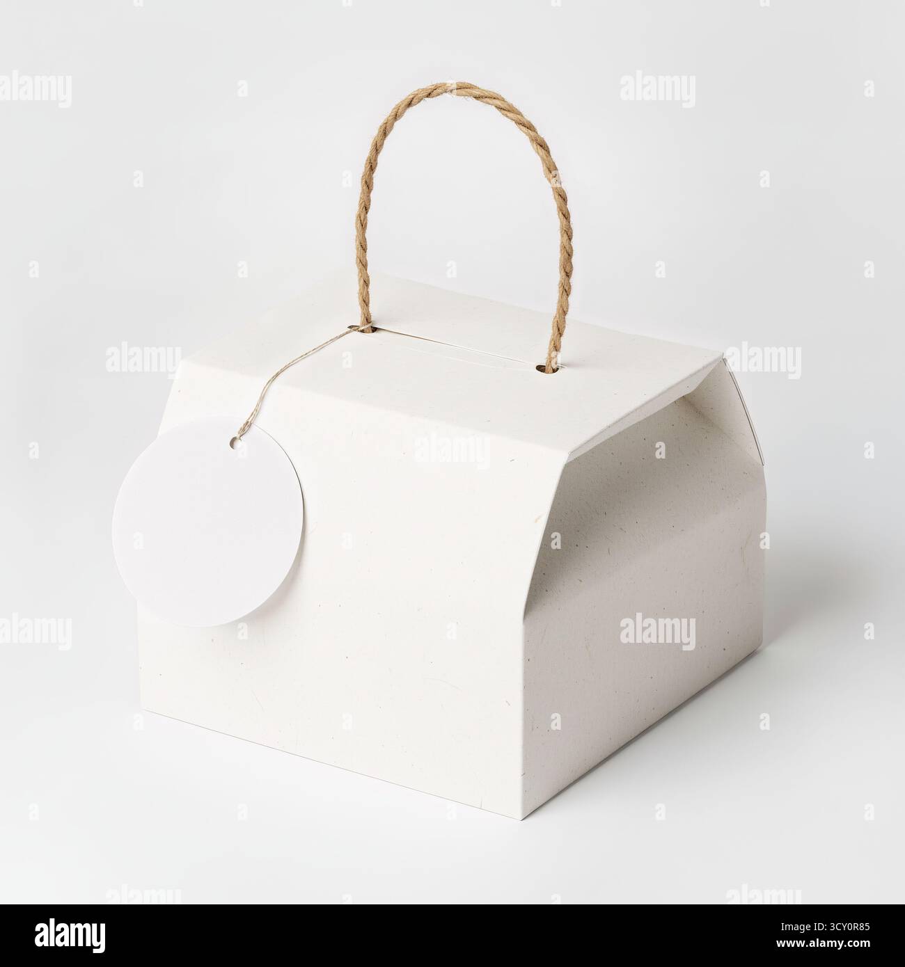 Mockup of white box with handle. Stock Photo