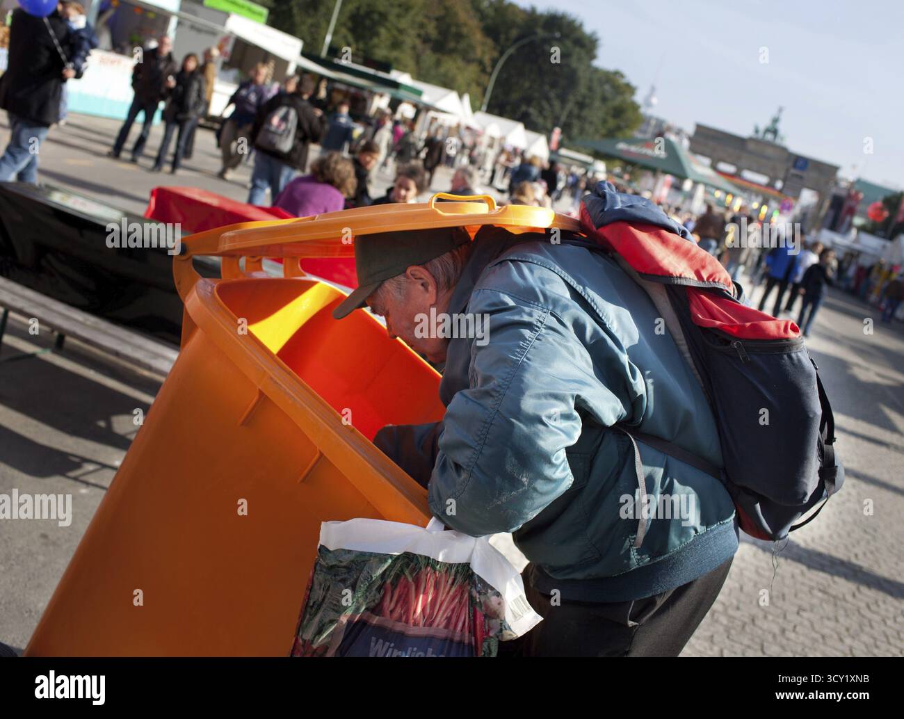 Garbage Check DEU Germany Berlin A collector checks the garbage cans for recyclable ...
