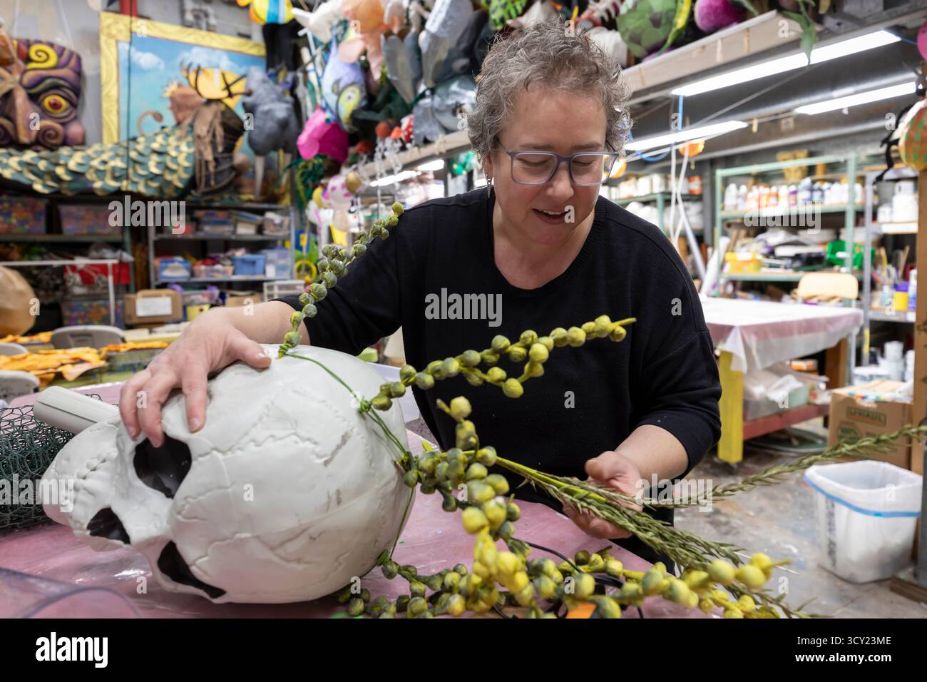 Brooke Fotheringham, an installation artist, prepares a piece during a workshop for the upcoming Día de los Muertos celebration at the Powerhouse Art Studio. Credit: Paul Christian Gordon/Alamy Live News Stock Photo