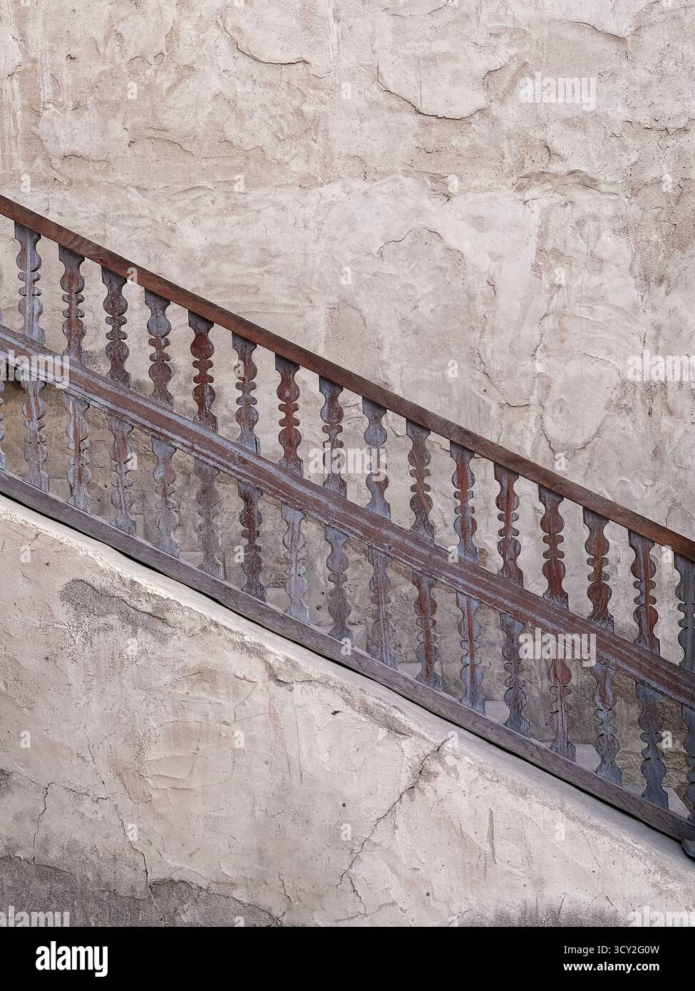 Textured Railing Textured stone stair with decorative metal railing in Al Seef, perfect ...