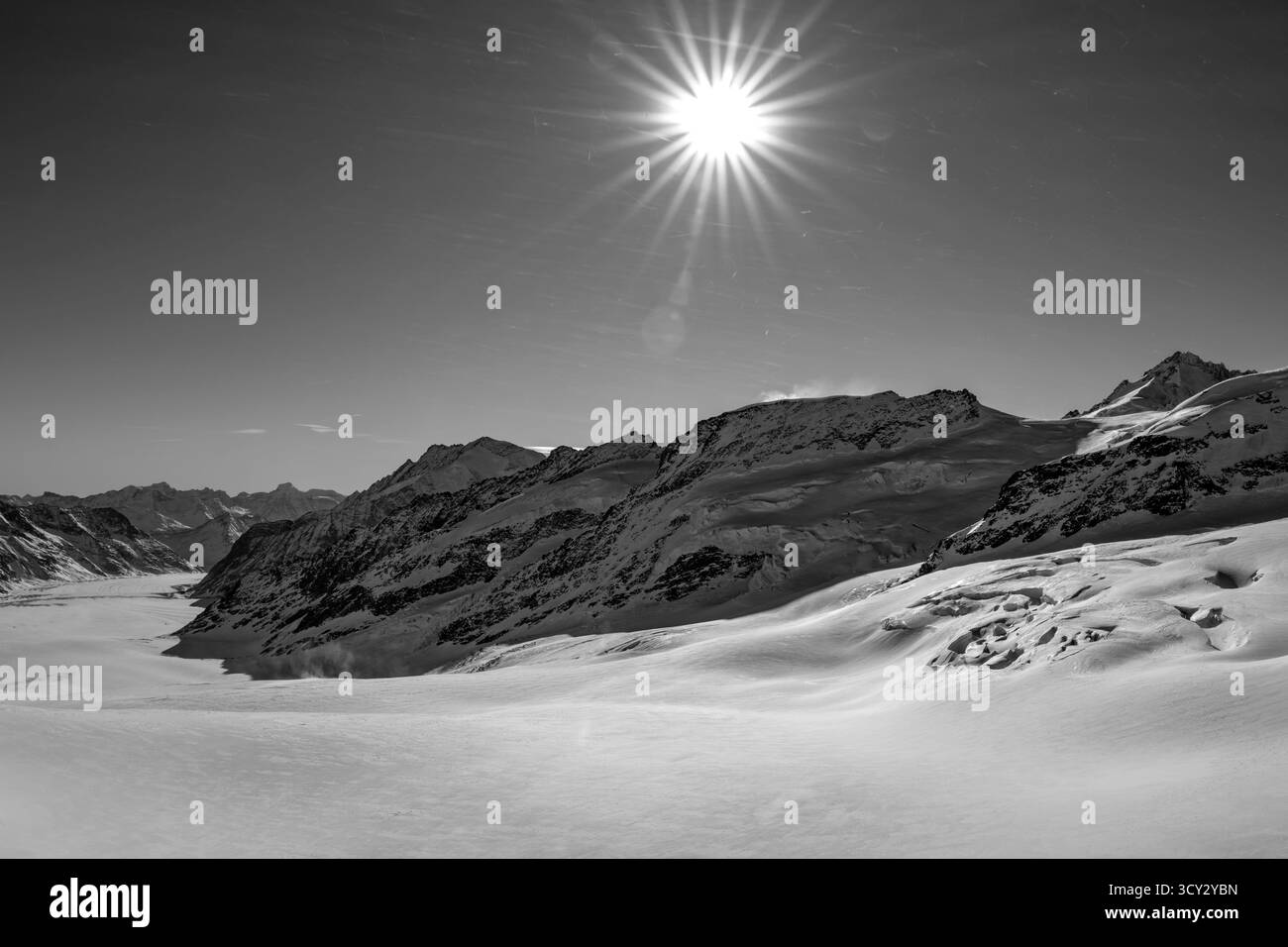 Beautiful Aletsch Glacier in a Sunny Winter Day with Snowcapped Mountain with Sunbeam in Jungfraujoch in Berner Oberland, Grindelwald, Canton Bern, Ca Stock Photo