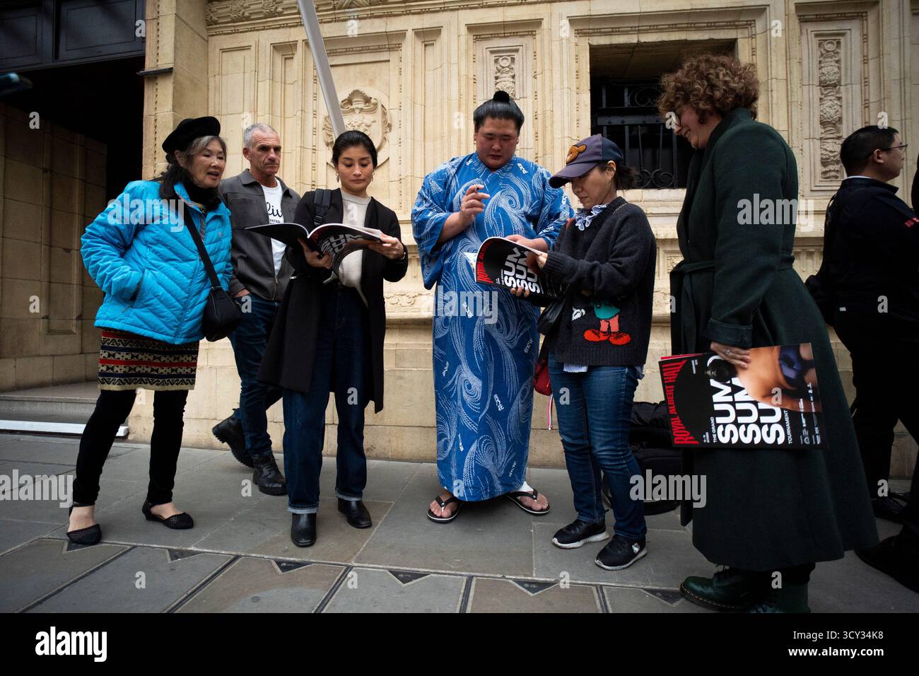 Sumo wrestlers, also known as Rikishi, signs autographs outside the ...
