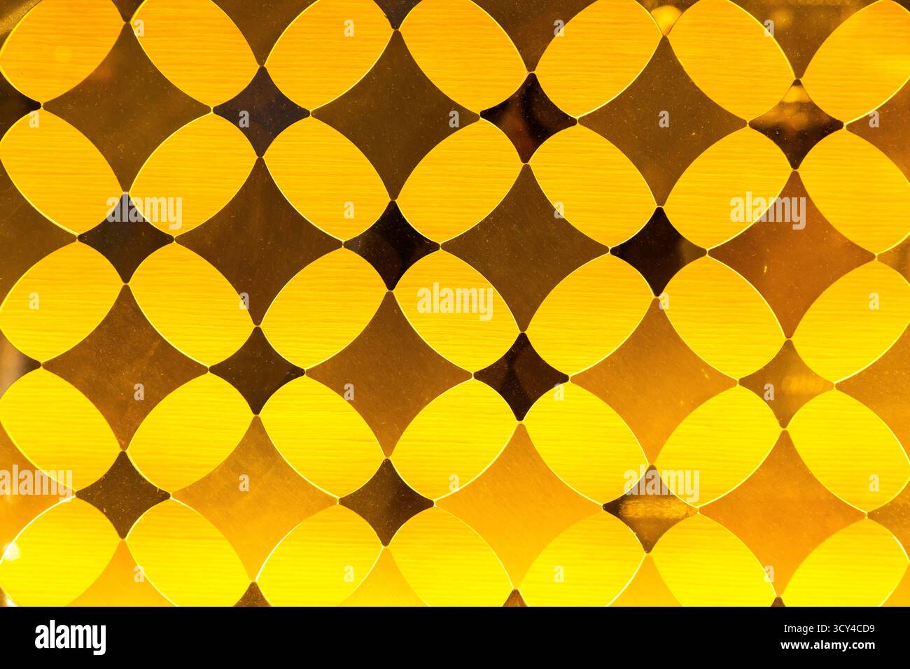 Yellow decorative translucent glass with a diamond pattern Stock Photo