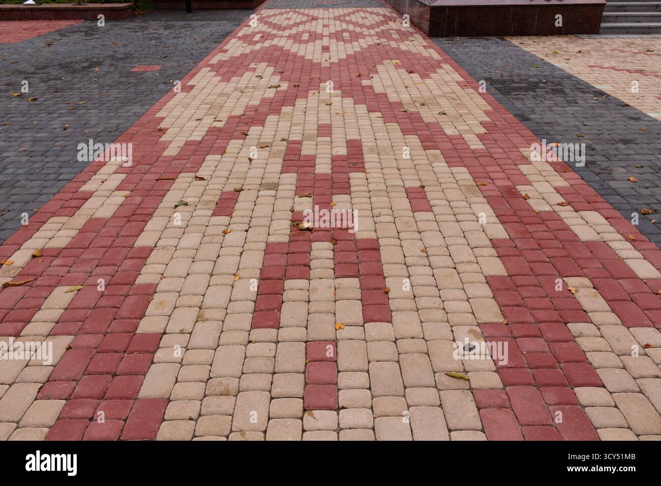 Belarusian patterns are lined with multi-colored paving slabs Stock Photo