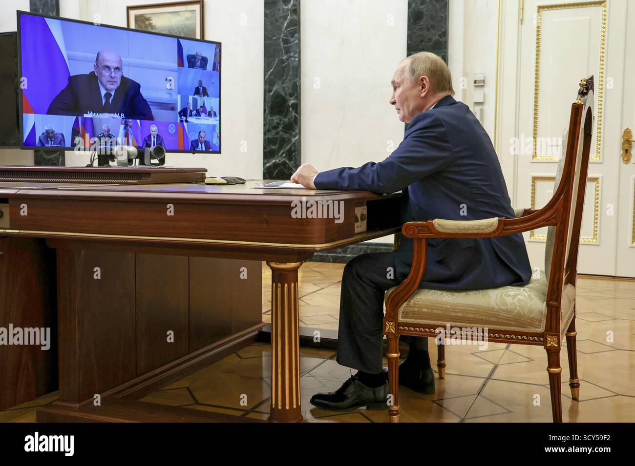 Russian President Vladimir Putin chairs a Security Council meeting via ...