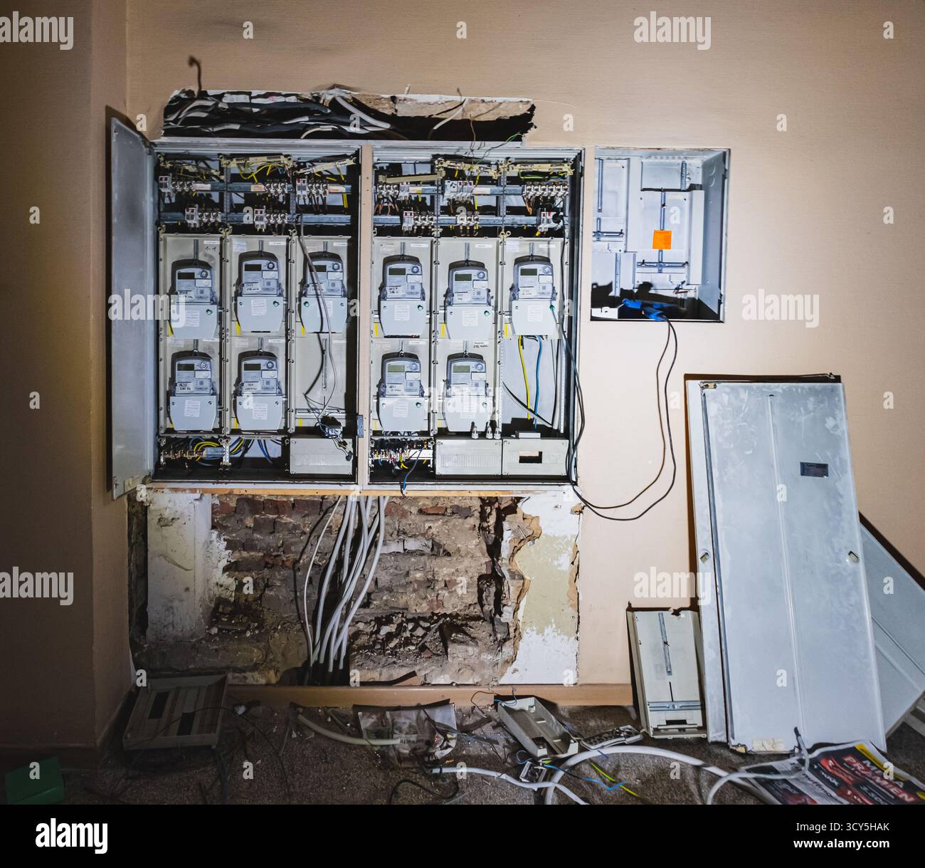An exposed electrical panel in a residential house, showing multiple ...