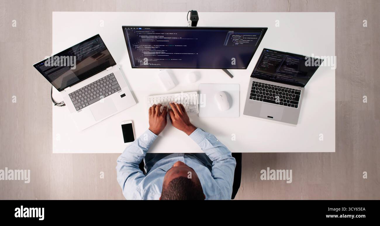 High Angle View Of African American Programmer Man Coding Efficiently Stock Photo