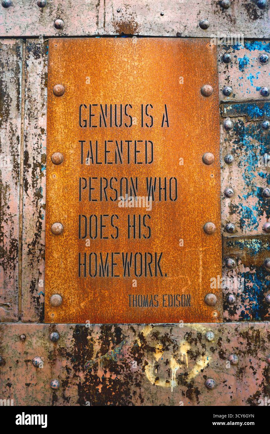 Thomas Edison quote engraved on rusted iron panel Stock Photo