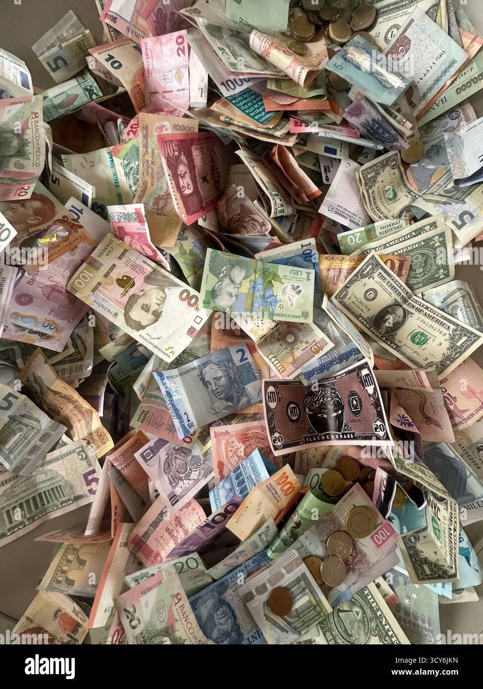pile of world paper money, Donations at the Petit Palais art museum , close up - Smartphone Captured Stock Image