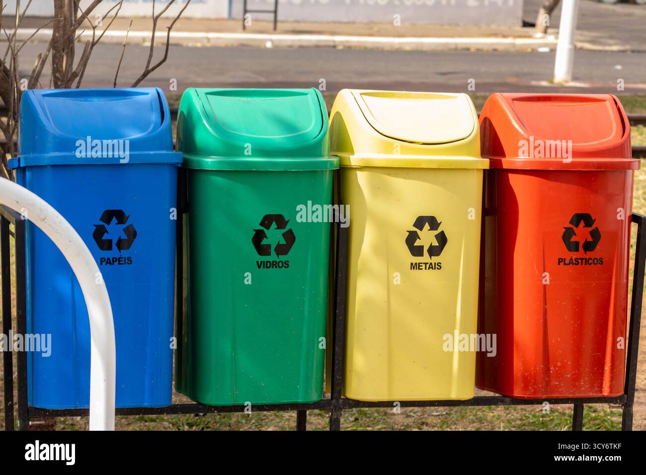 Colorful recycling bins for paper, glass, metal, and plastic in Brazil ...