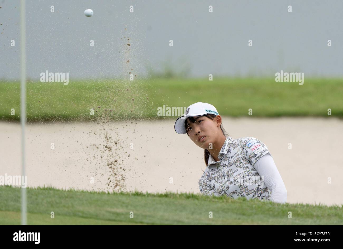 Haenam, South Korea. 17th Oct, 2025. Saki Baba from Japan, plays again her bunker shot on the 18th fairway during their second round of the LPGA BMW Ladies Championship 2025 at Pine Beach C.C in Haenam, South of Seoul, South Korea on October 17, 2025. (Photo by: Lee Young-ho/Sipa USA) Credit: Sipa USA/Alamy Live News Stock Photo