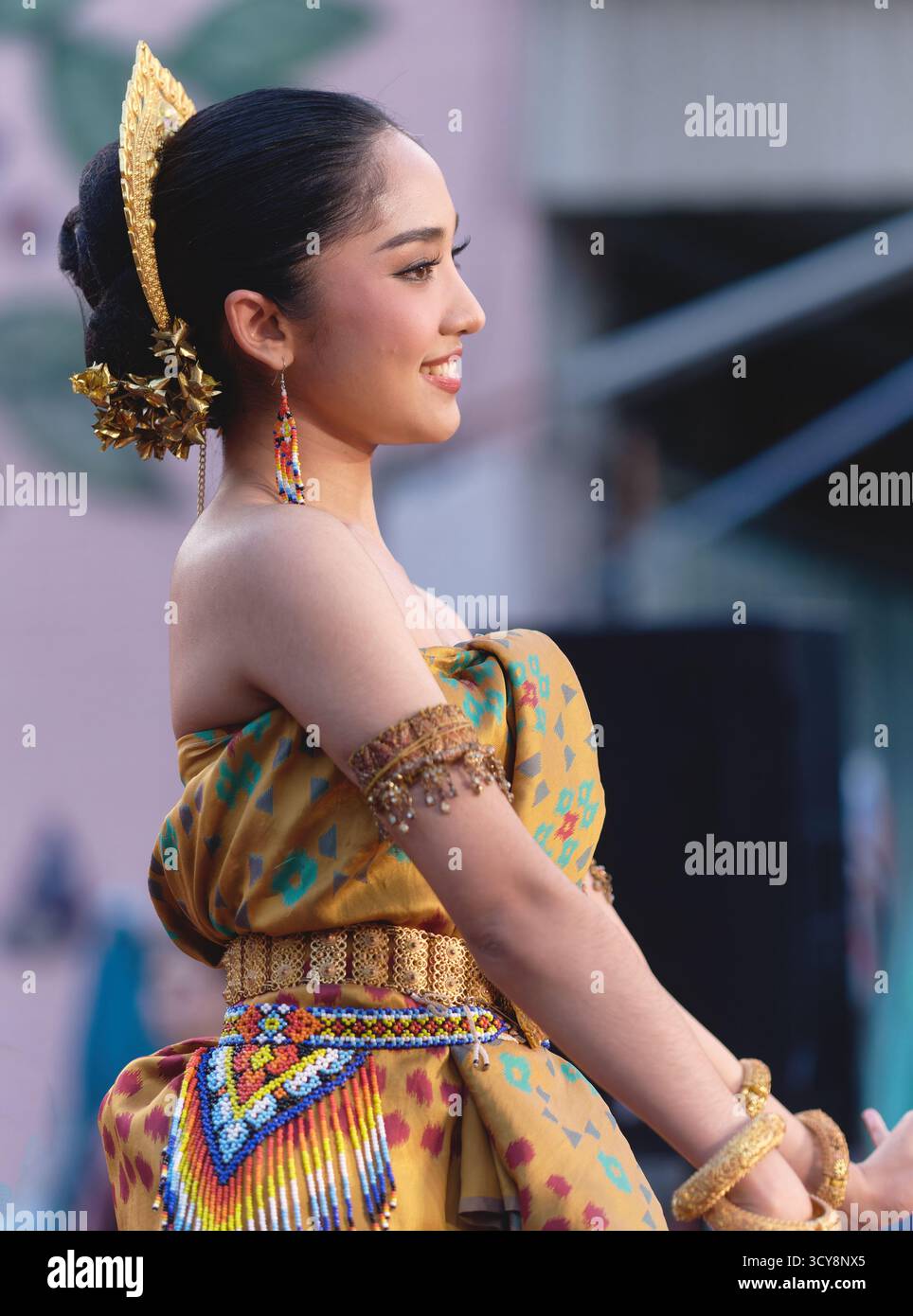 A female classical Thai dancer in extravagant traditional costume, during Diwali celebrations in Phahurat / Pahurat, Bangkok, Thailand Stock Photo