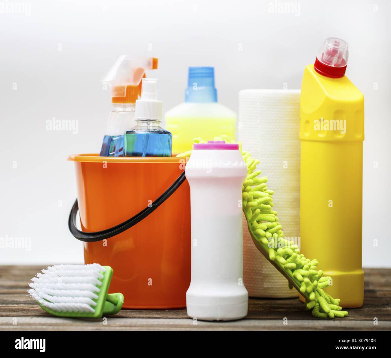 Bucket with cleaning items on light background Stock Photo