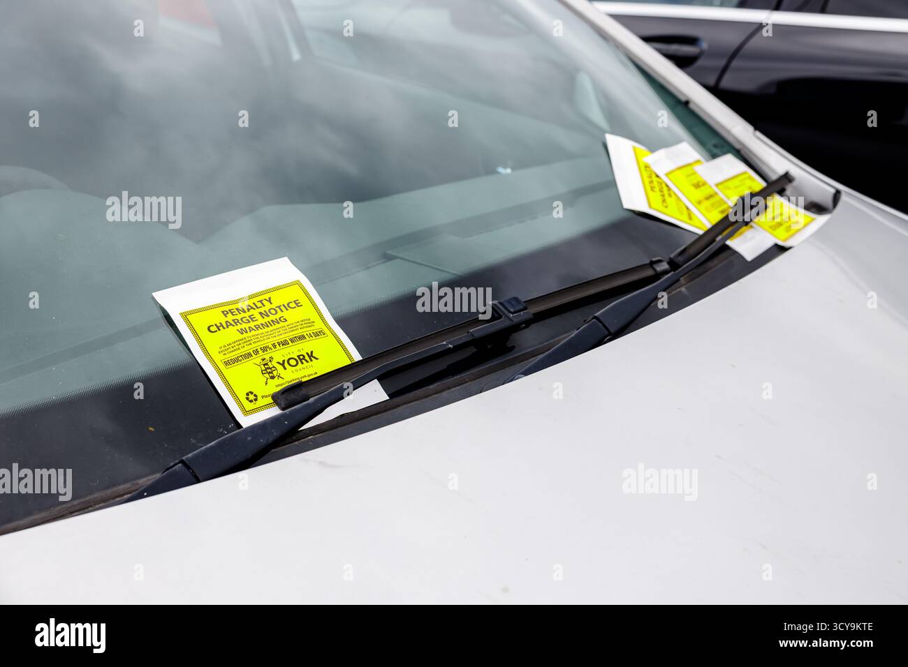 Parked Vehicle with Penalty Charge Notice - "Parking Violation Notice" Stock Photo