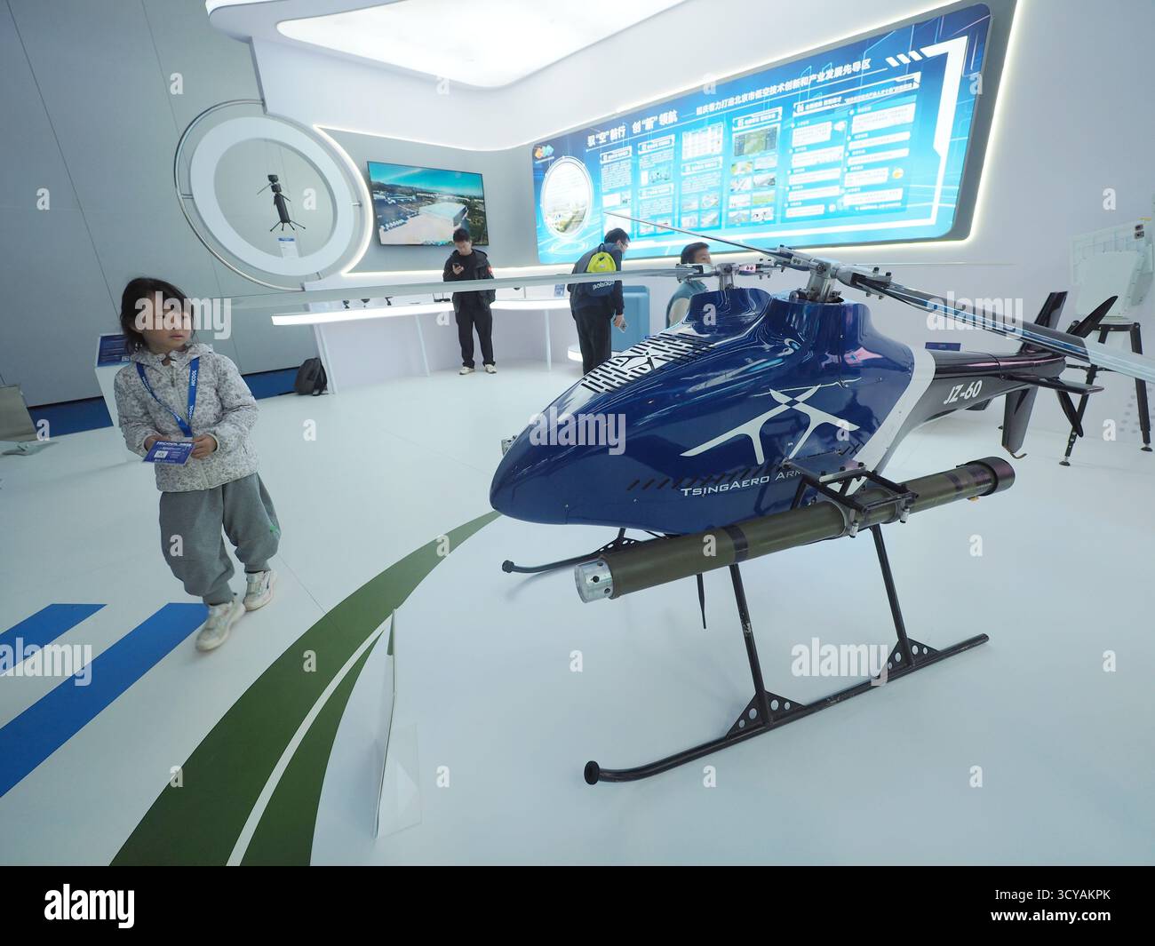 Visitors visit a medium-sized composite wing drone at the HICOOL 2025 ...