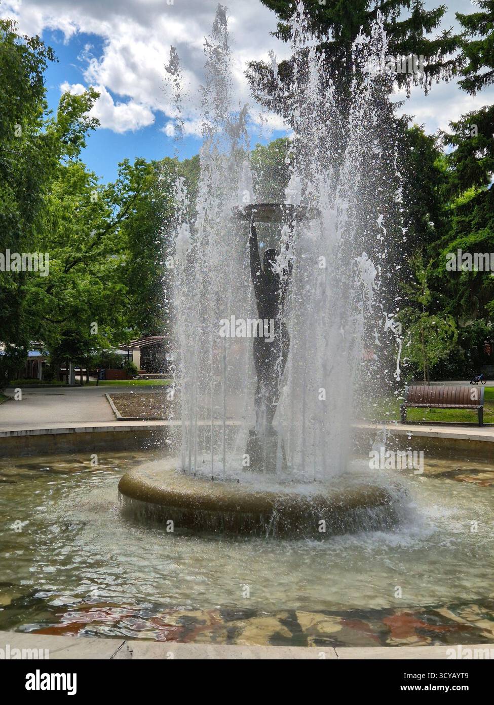 The greatness of water: a central fountain with a sculpture in the resort town of Hisar, Bulgaria - Smartphone Captured Stock Image