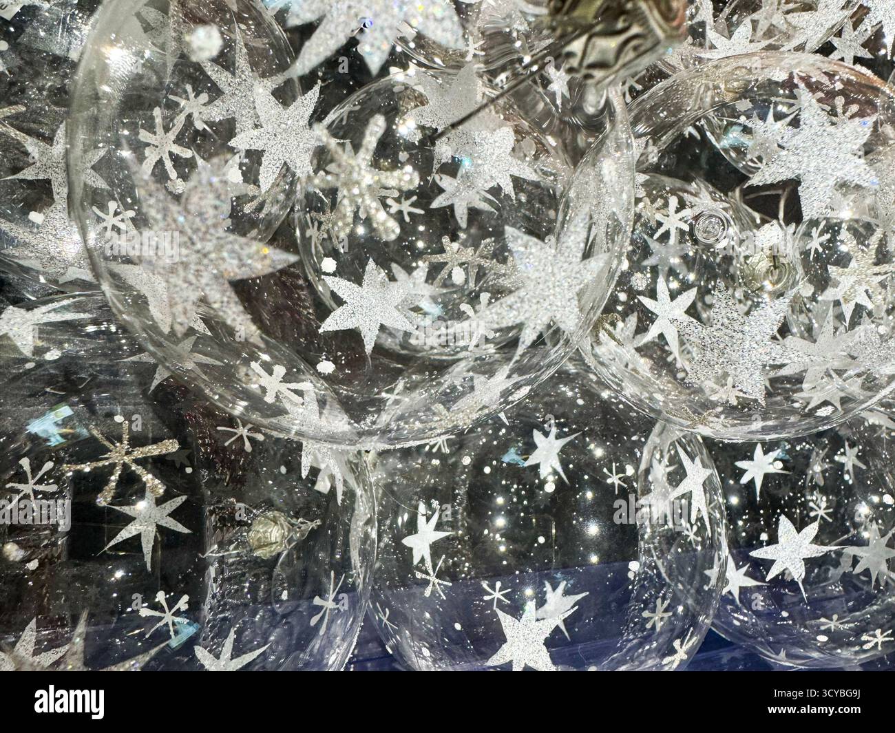 Berlin, Germany, 2 October 2025, Shop with INGES Manufacturer of glass Christmas tree decorations. Close up of clear glass christmas baubles with whit - Smartphone Captured Stock Image