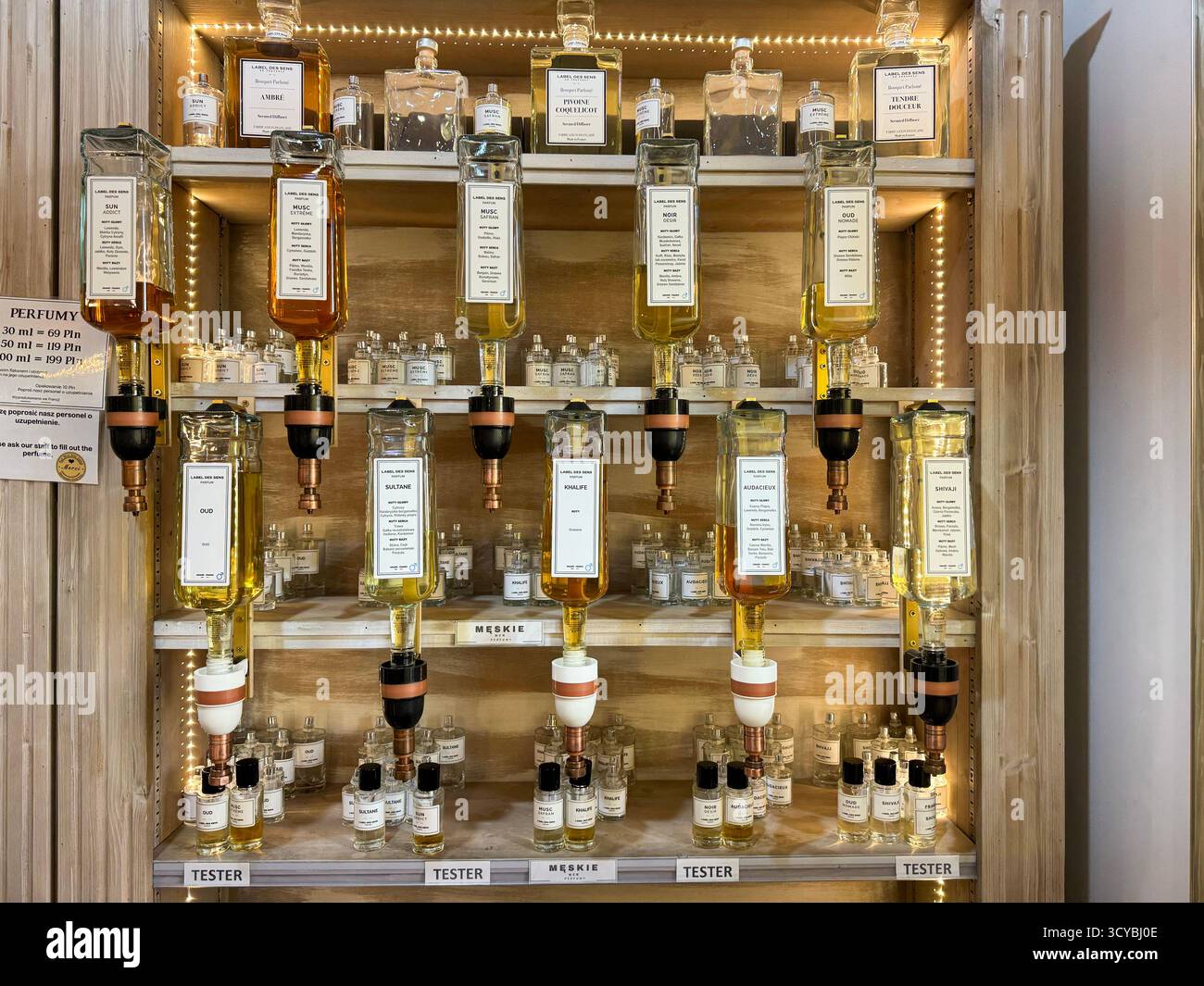 Warsaw, Poland, 12 October 2025,  Brend Label des sens.  Vintage perfume counter with large dispenser bottles on display - Smartphone Captured Stock Image
