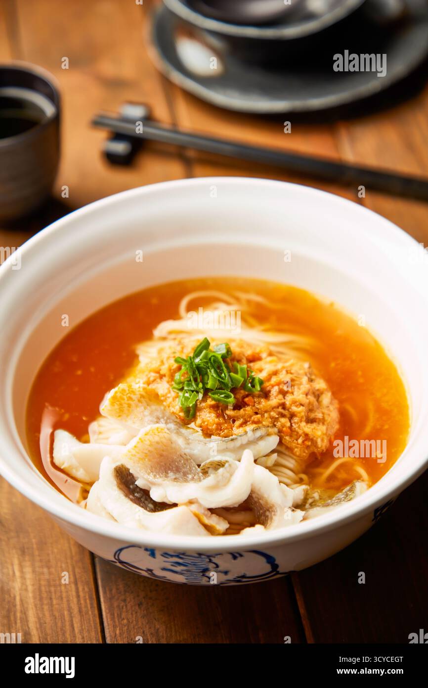 Crab Roe Rice Chinese Fresh Crab Roe and Yellow Croaker Noodles in Savory Broth side view of ...