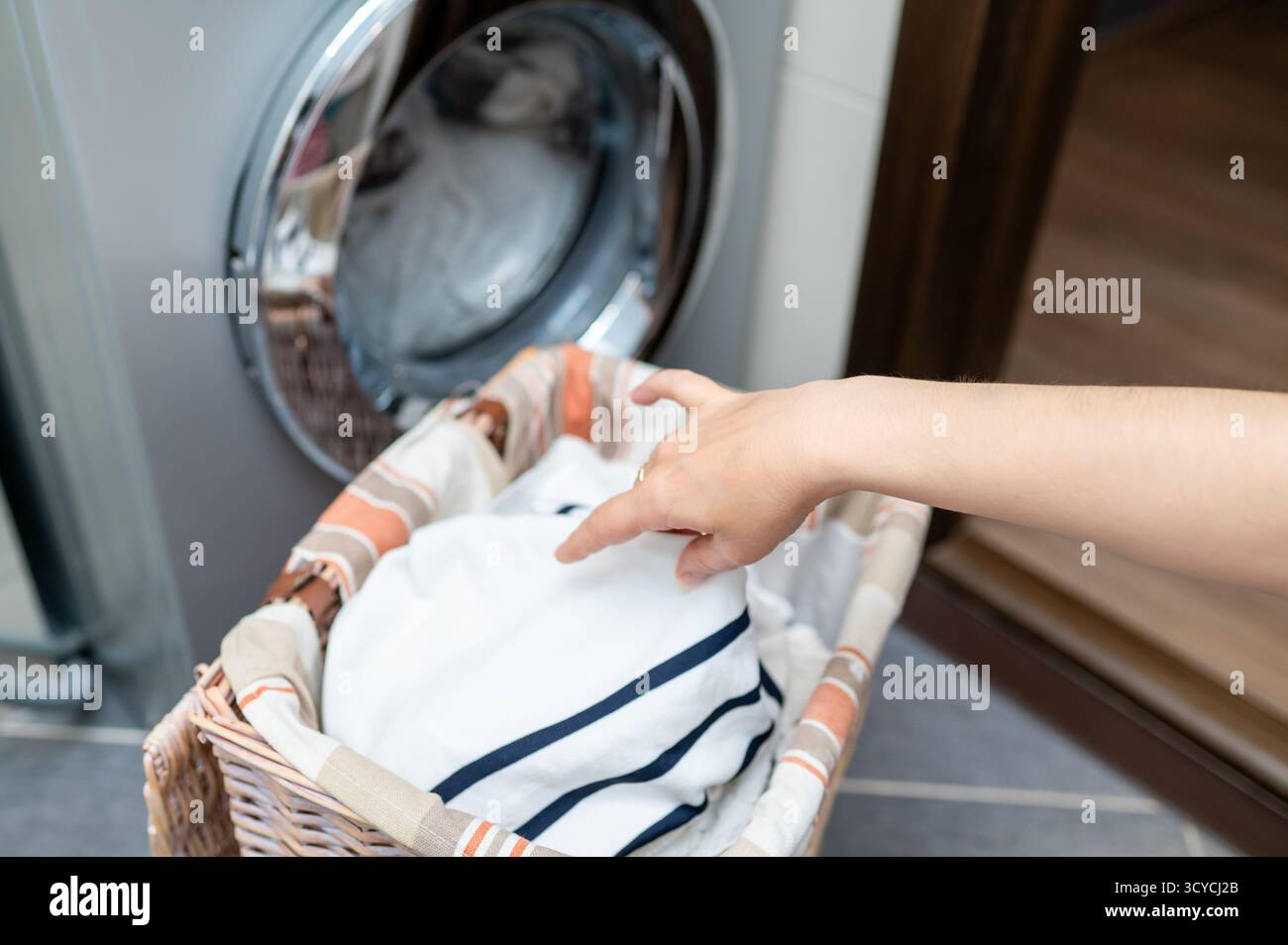 Woman removing her clothes hi-res stock photography and images - Alamy