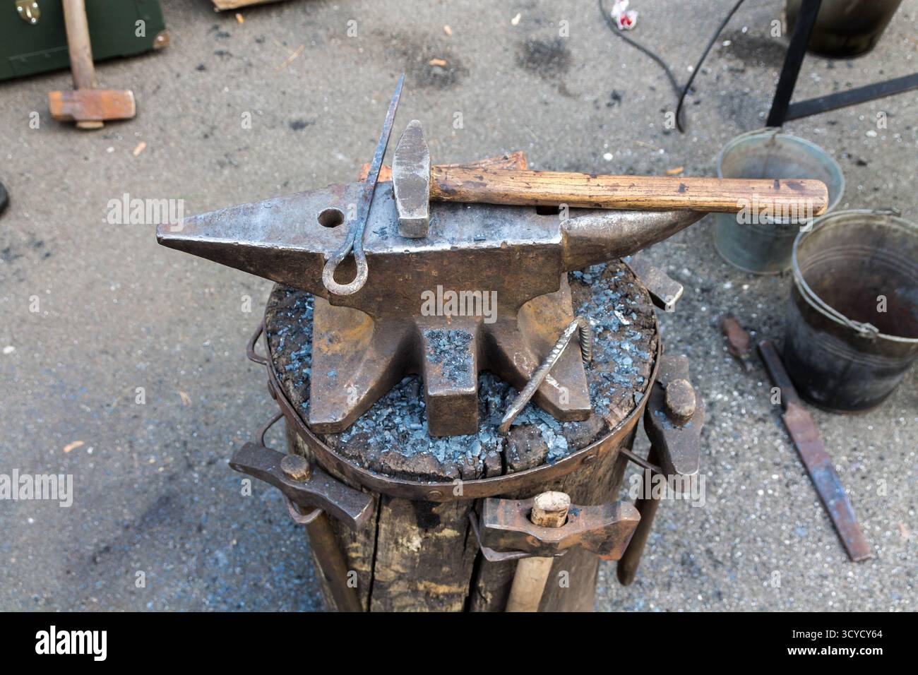 Anvil on a stump. Tools and anvil blacksmith. Stock Photo