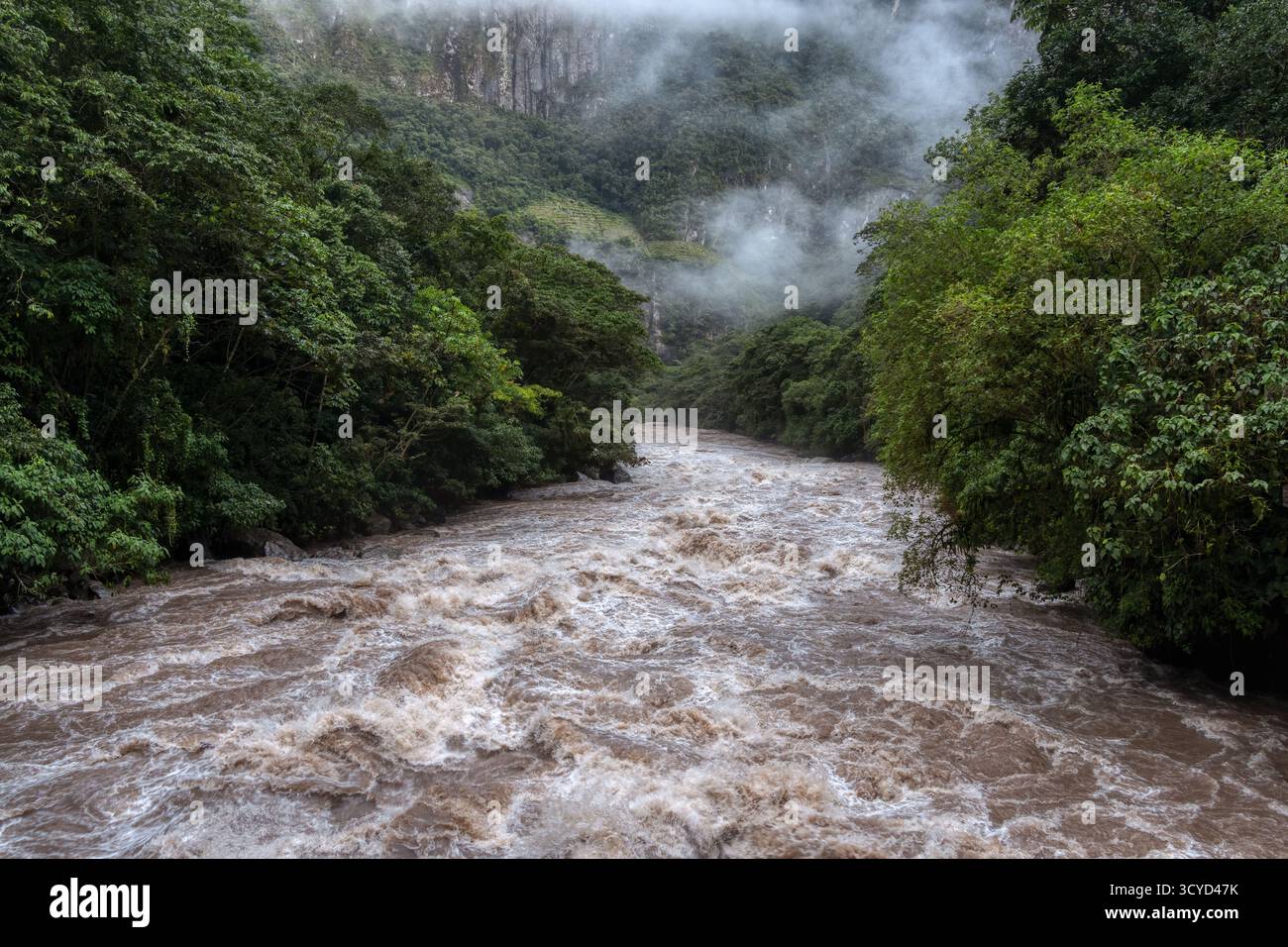 Scenic dramatic view with the powerful waters of Urubamba River crossing the Sacred Valley in Aguas Calientes Stock Photo
