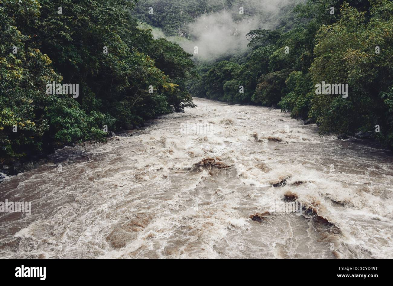 Scenic dramatic view with the powerful waters of Urubamba River crossing the Sacred Valley in Aguas Calientes Stock Photo