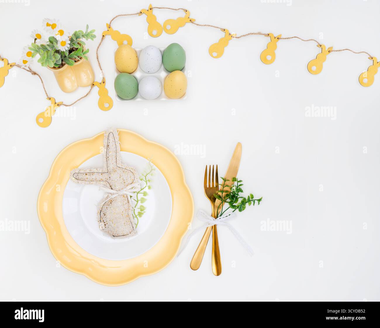 Happy Easter. Easter celebration concept. Top view vertical empty white, yellow plate, decorative rabbit, eggs, isolated white background. Copy space, Stock Photo