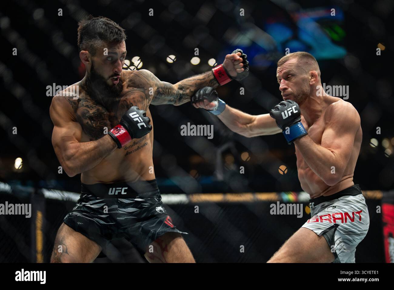 Charles Jourdain, left, of Canada, and Davey Grant fight during their ...