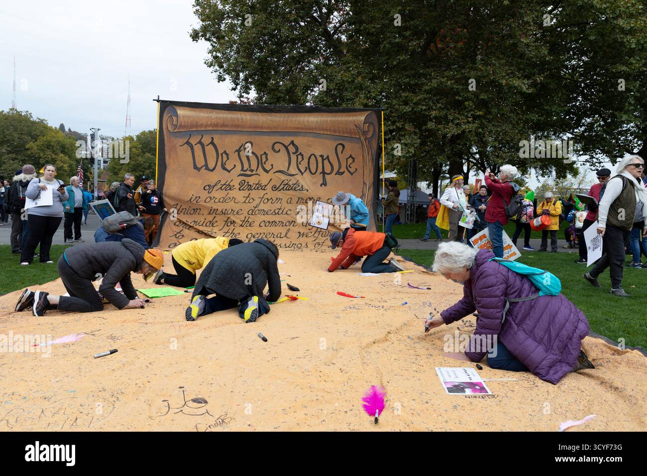 Seattle, Washington, USA. 18th October 2025. Protesters fill Fisher Pavilion at the “No Kings” protest and march. An estimated 90,000 people attended the mass protest as part of a national day of peaceful action organized by the No Kings coalition in response to perceived authoritarian actions and corruption of the Trump administration. Credit: Paul Christian Gordon/Alamy Live News Stock Photo