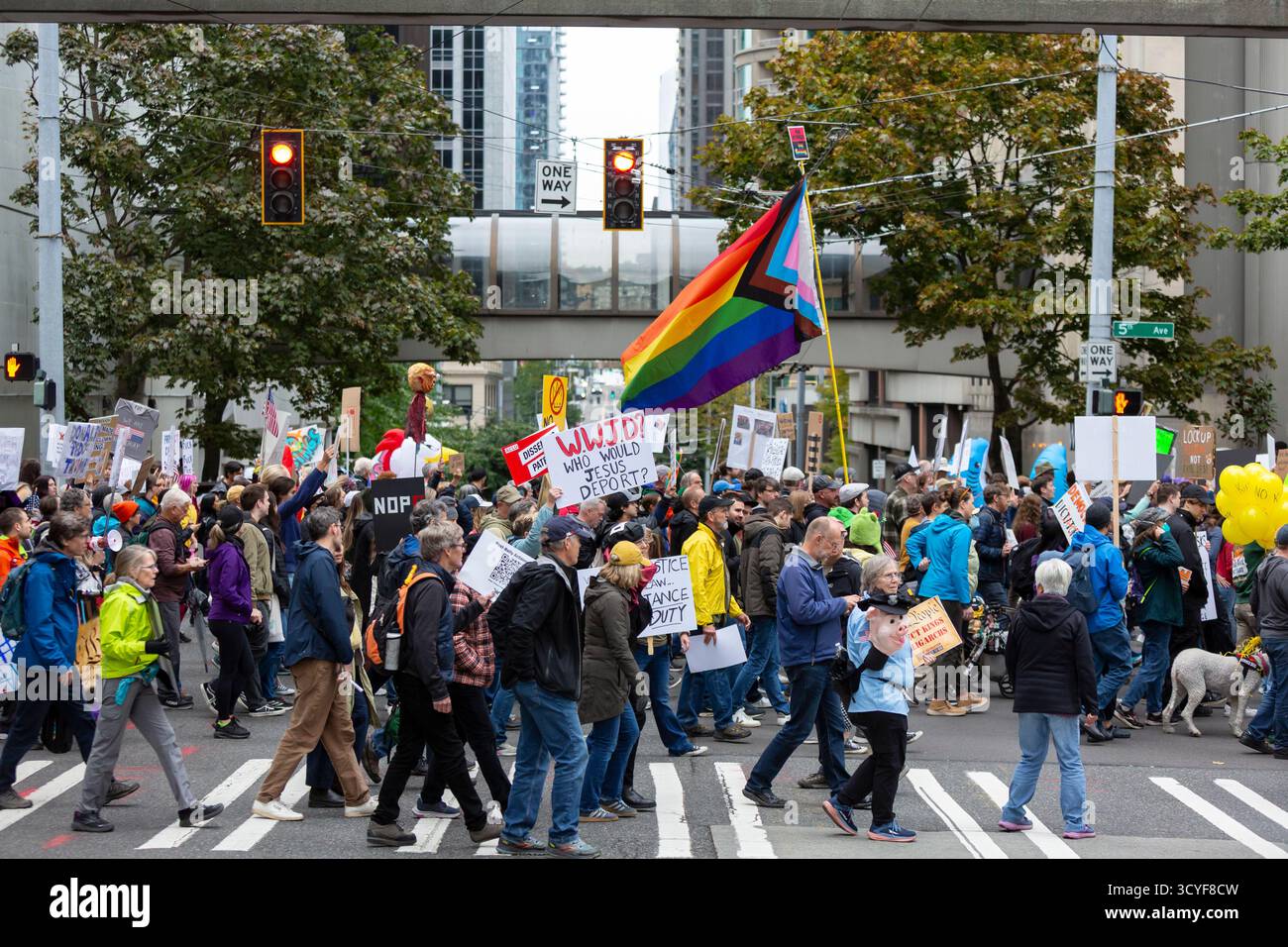 Seattle, Washington, USA. 18th October 2025. Protesters lead the way at the “No Kings” protest and march. An estimated 90,000 people attended the mass protest as part of a national day of peaceful action organized by the No Kings coalition in response to perceived authoritarian actions and corruption of the Trump administration. Credit: Paul Christian Gordon/Alamy Live News Stock Photo
