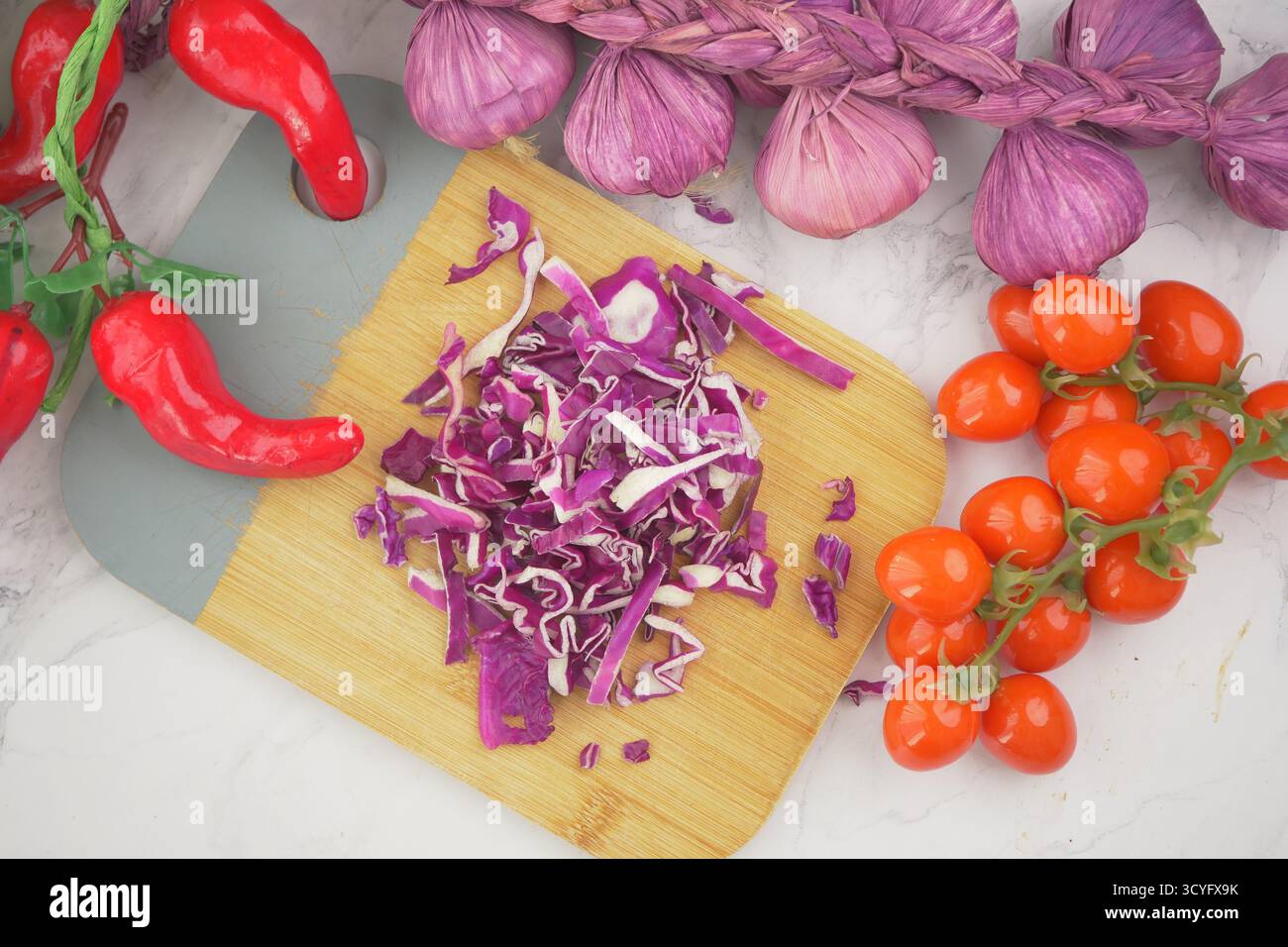 Chopping fresh vegetables in the kitchen Stock Photo