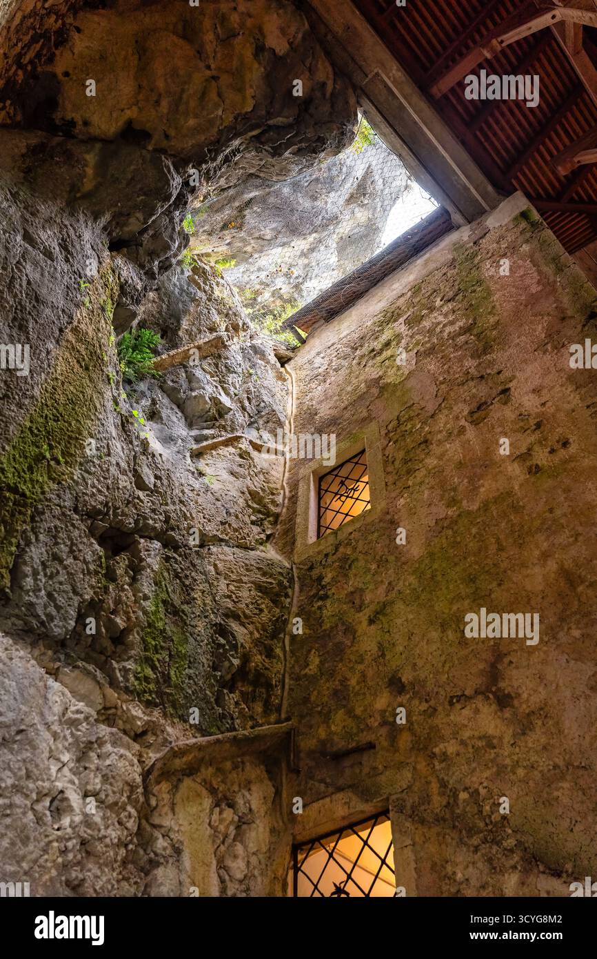 Construction of walls by digging the rock in the cave of Predjama ...